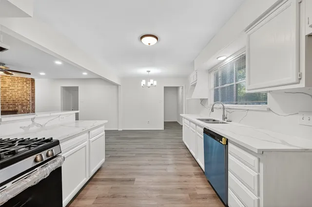 a large kitchen with a stove top oven