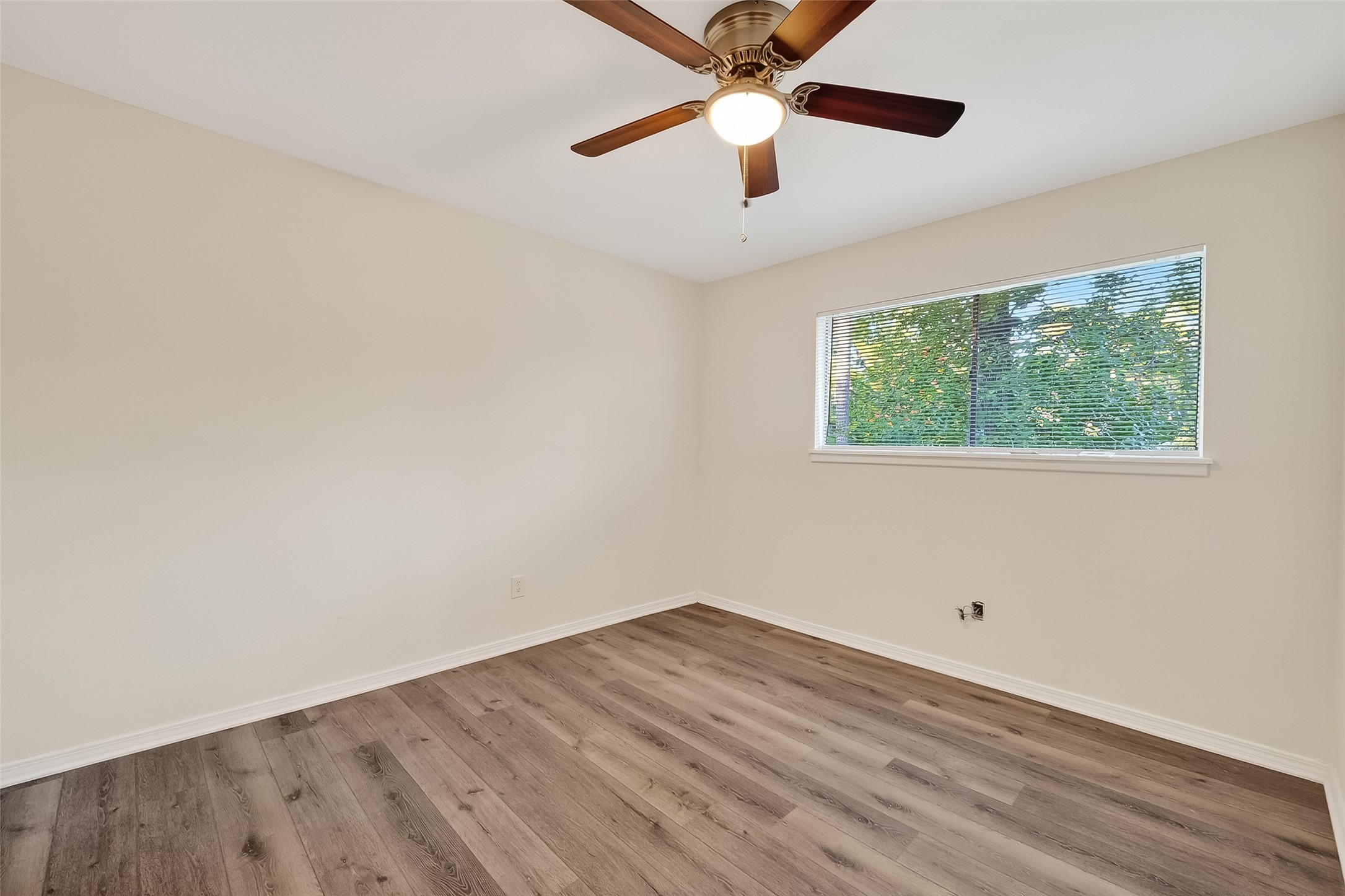 26522 Hillside Drive Spring, TX 77386 - Photo 24 of 45 an empty room with wooden floor and windows