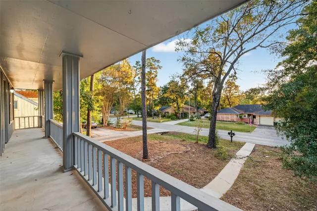 a view of a porch with a tree back yard