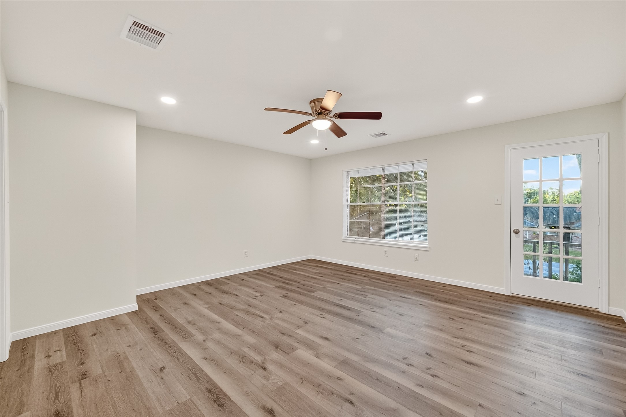 26522 Hillside Drive Spring, TX 77386 - Photo 39 of 45 a view of an empty room with wooden floor and a window