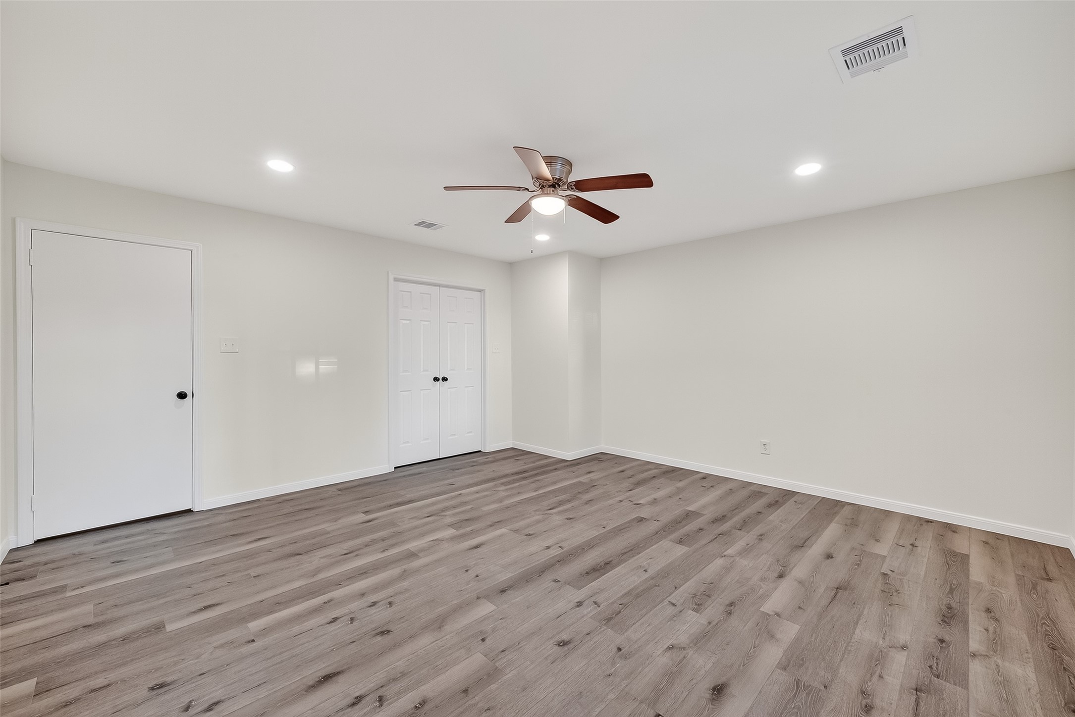 26522 Hillside Drive Spring, TX 77386 - Photo 40 of 45 a view of an empty room with a ceiling fan