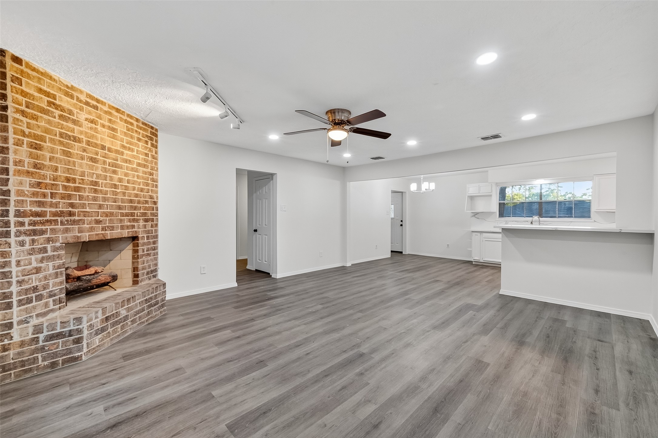 26522 Hillside Drive Spring, TX 77386 - Photo 10 of 45 a view of an empty room with a fireplace and a window
