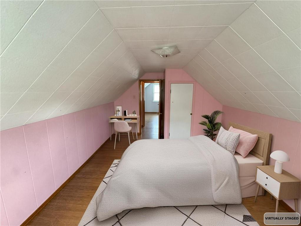 488 Meadow Road Irwin, PA 15642 - Photo 13 of 23 a bedroom with a bed and a chandelier