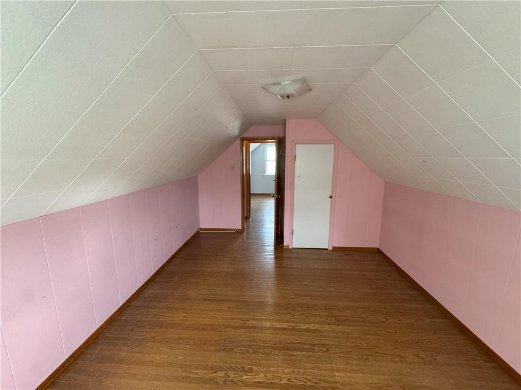 488 Meadow Road Irwin, PA 15642 - Photo 14 of 23 a view of an empty room with wooden floor