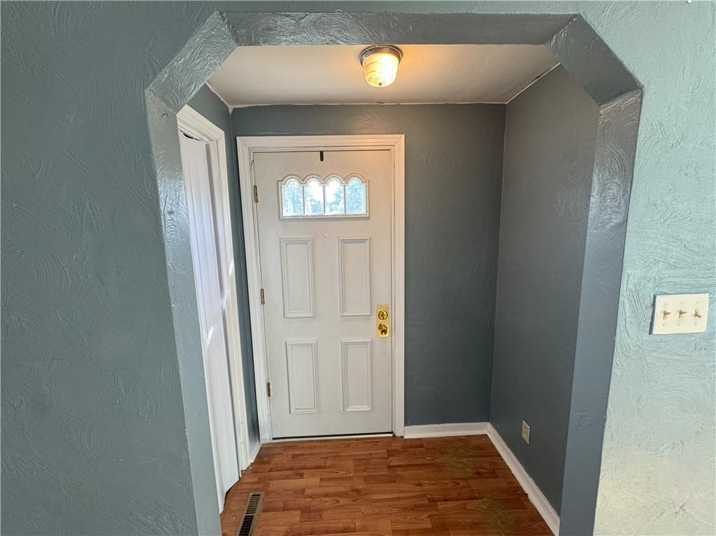 488 Meadow Road Irwin, PA 15642 - Photo 2 of 23 a view of a hallway with wooden floor