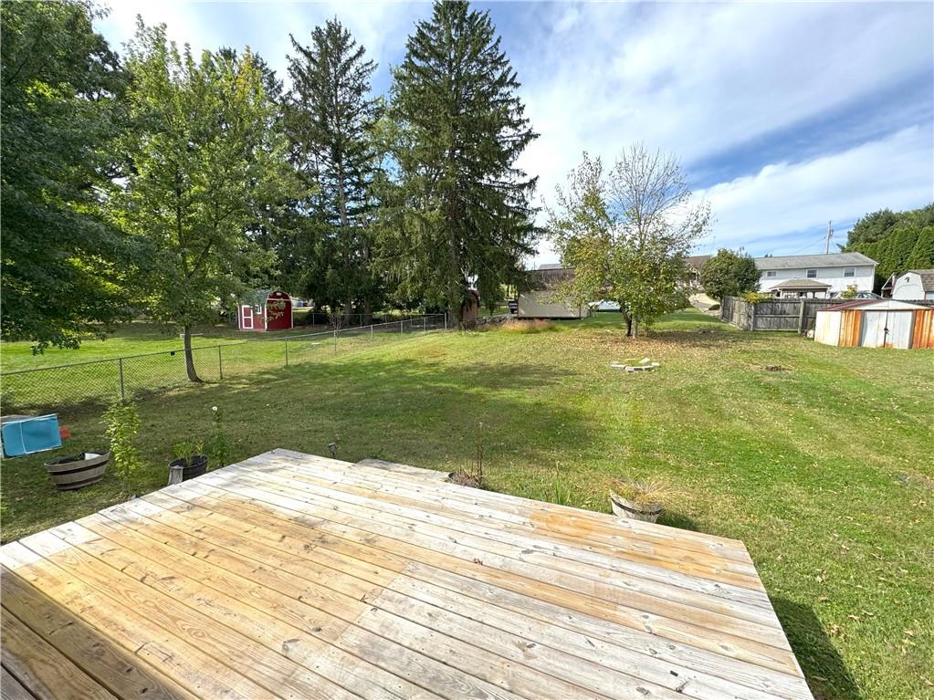488 Meadow Road Irwin, PA 15642 - Photo 22 of 23 a backyard of a house with lots of green space and fountain