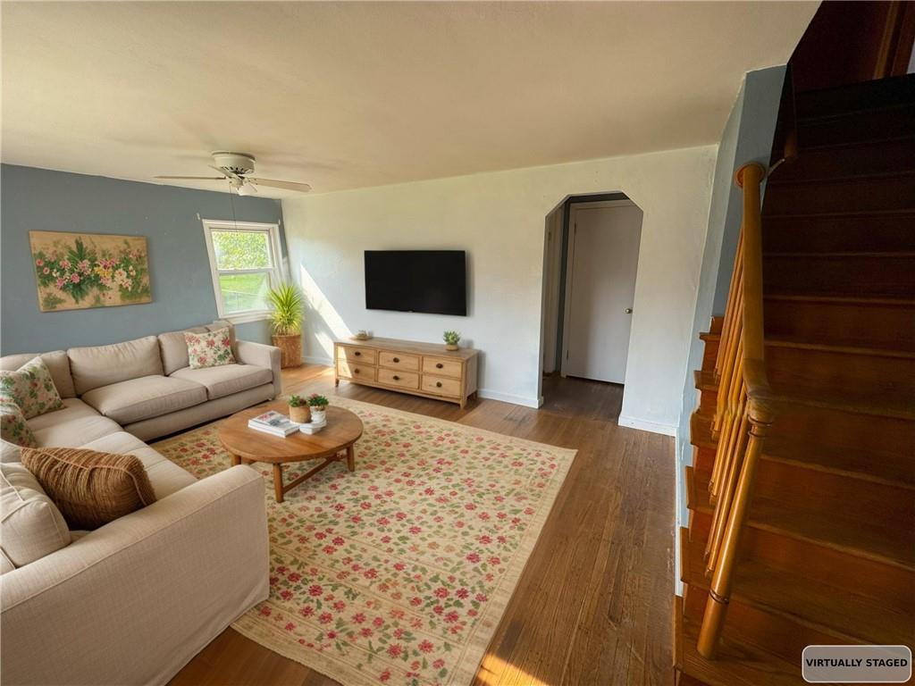 488 Meadow Road Irwin, PA 15642 - Photo 3 of 23 a living room with furniture and a flat screen tv