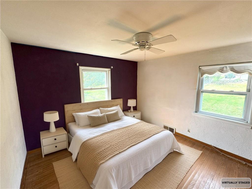 488 Meadow Road Irwin, PA 15642 - Photo 8 of 23 a bedroom with a large bed and a window