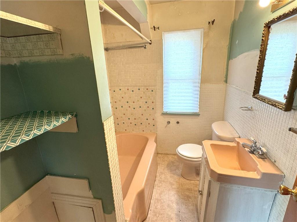 488 Meadow Road Irwin, PA 15642 - Photo 10 of 23 a bathroom with a sink toilet and shower