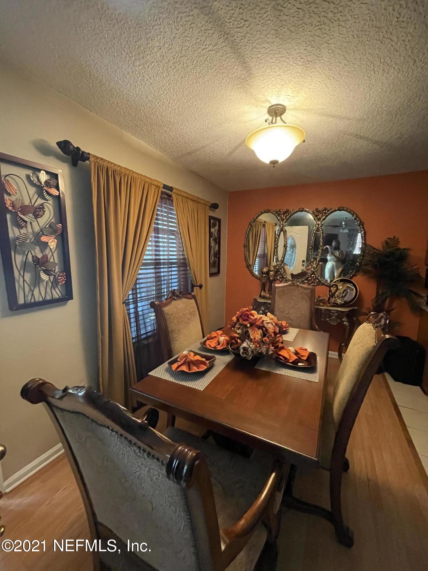 2056 Talladega Road Jacksonville, FL 32209 - Photo 3 of 19 a room with furniture and window
