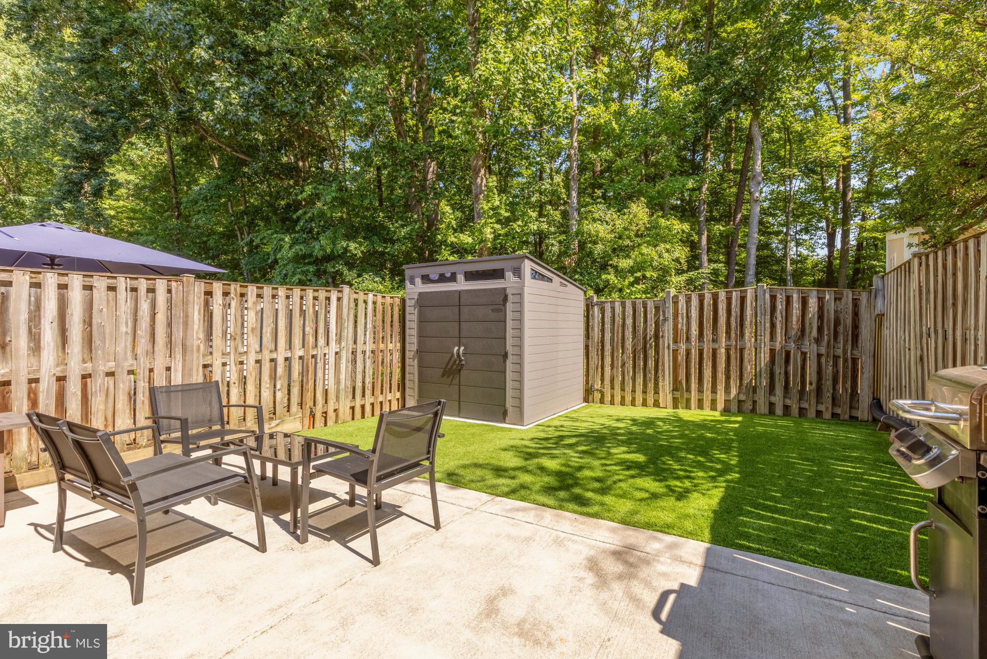 8100 Loving Forest Court Springfield, VA 22153 - Photo 30 of 33 a view of a backyard with a chair and table