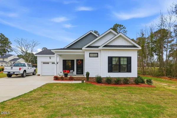 a view of a house with outdoor space and porch