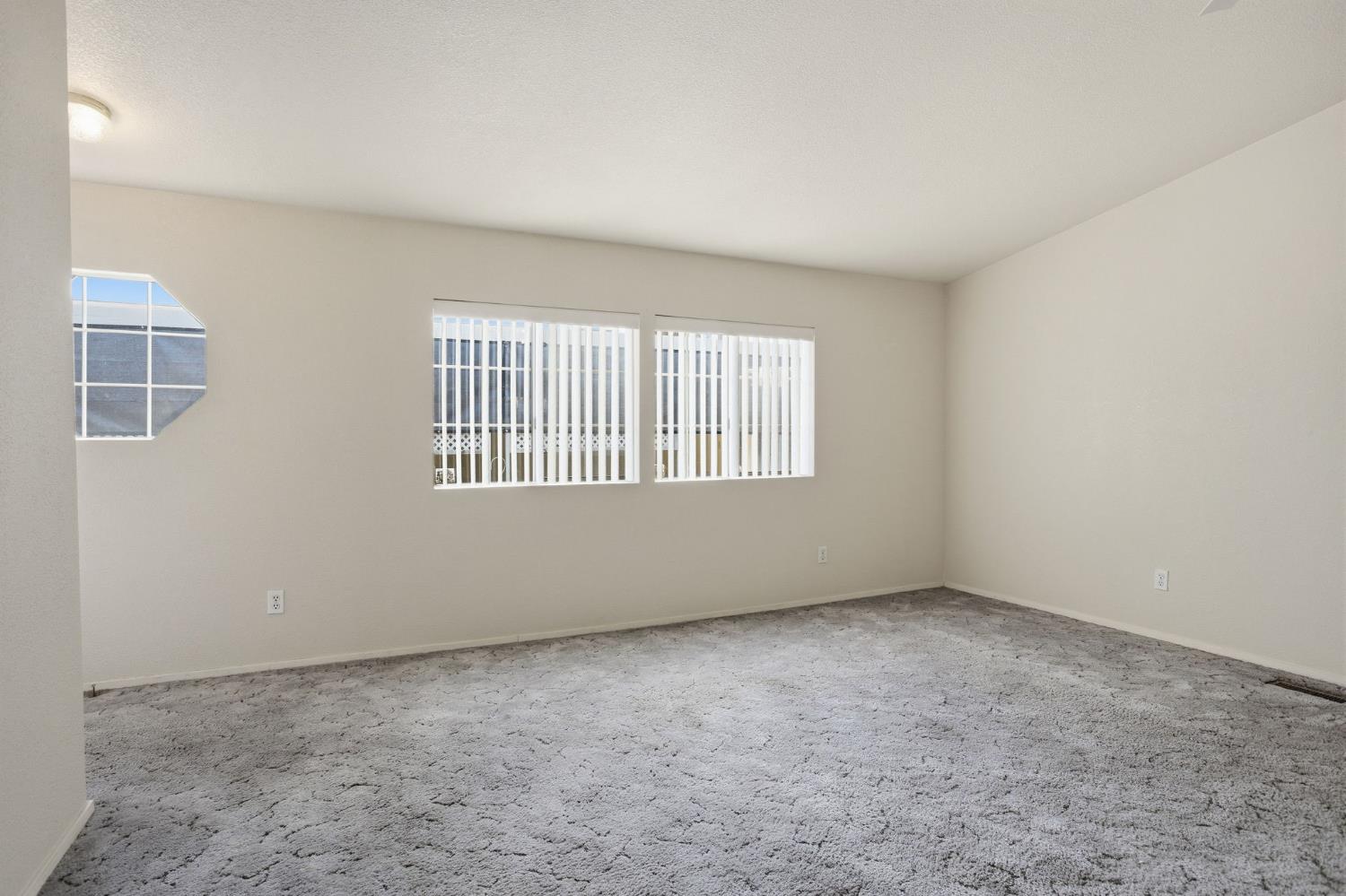 700 2nd Street, Unit 40 Galt, CA 95632 - Photo 13 of 35 an empty room with windows