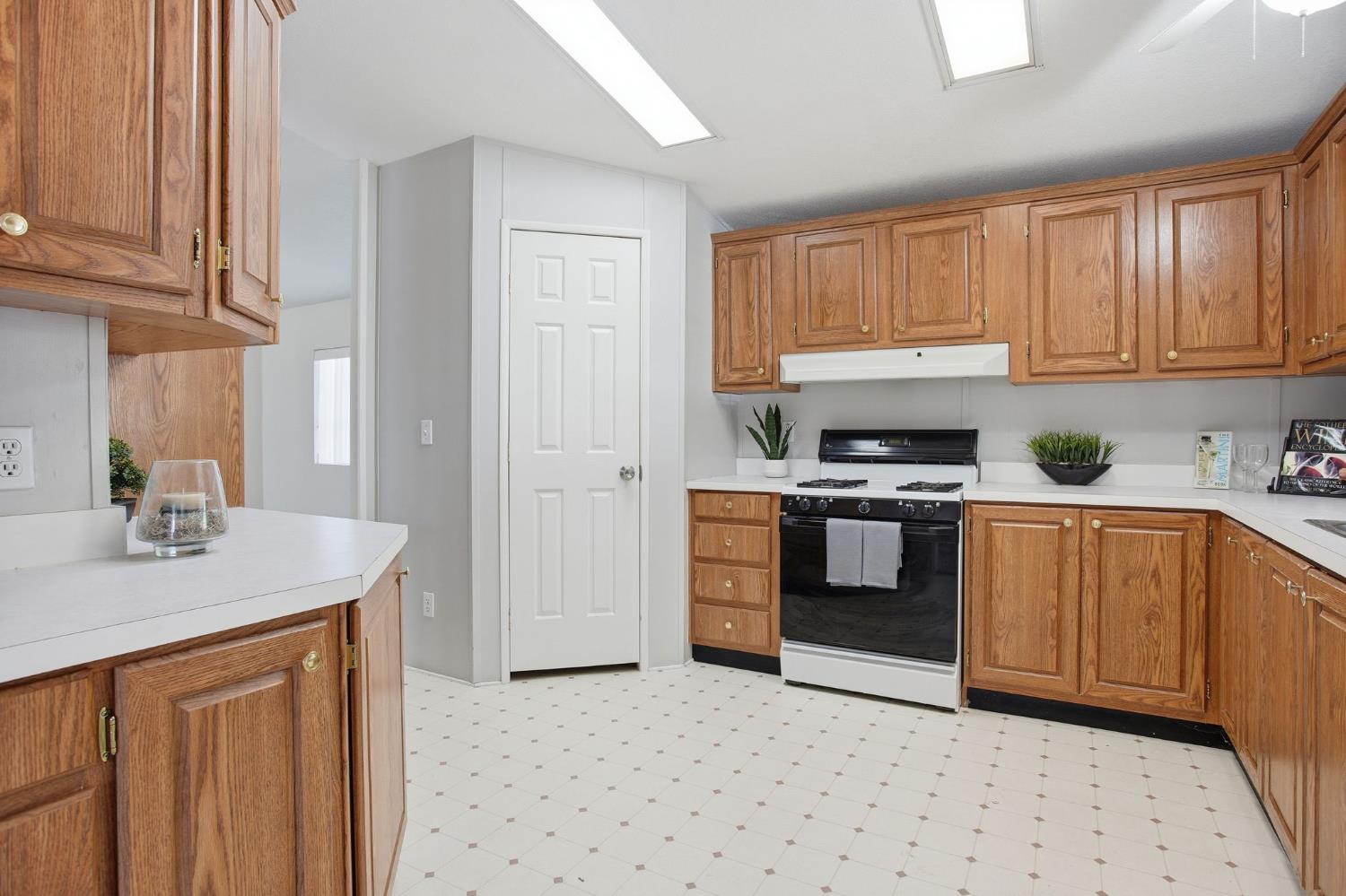 700 2nd Street, Unit 40 Galt, CA 95632 - Photo 16 of 35 a kitchen with stainless steel appliances granite countertop a stove a sink and a refrigerator