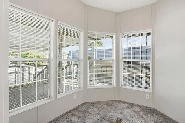 a view of empty room with windows