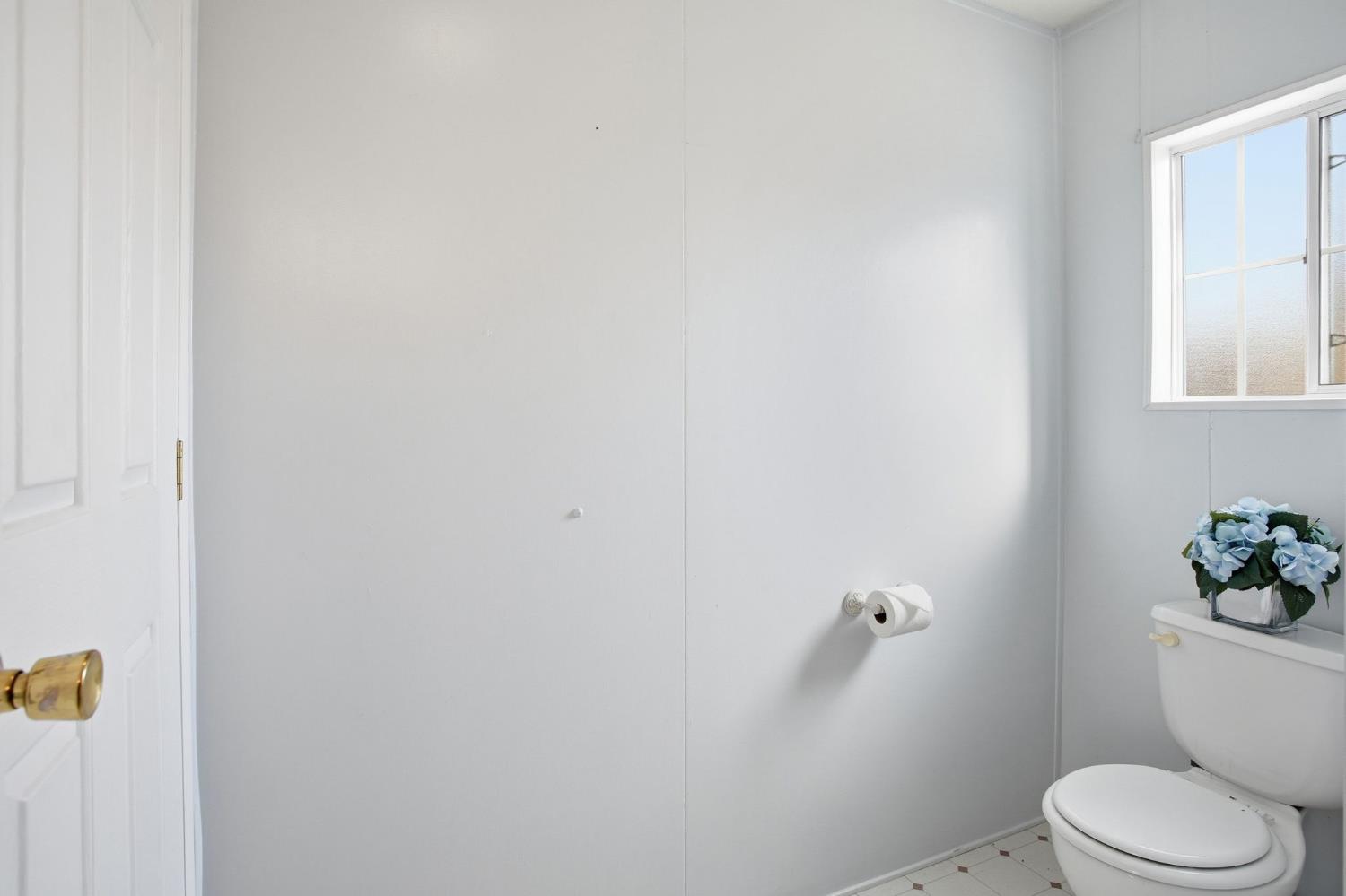 700 2nd Street, Unit 40 Galt, CA 95632 - Photo 31 of 35 a white toilet sitting next to a bathroom sink