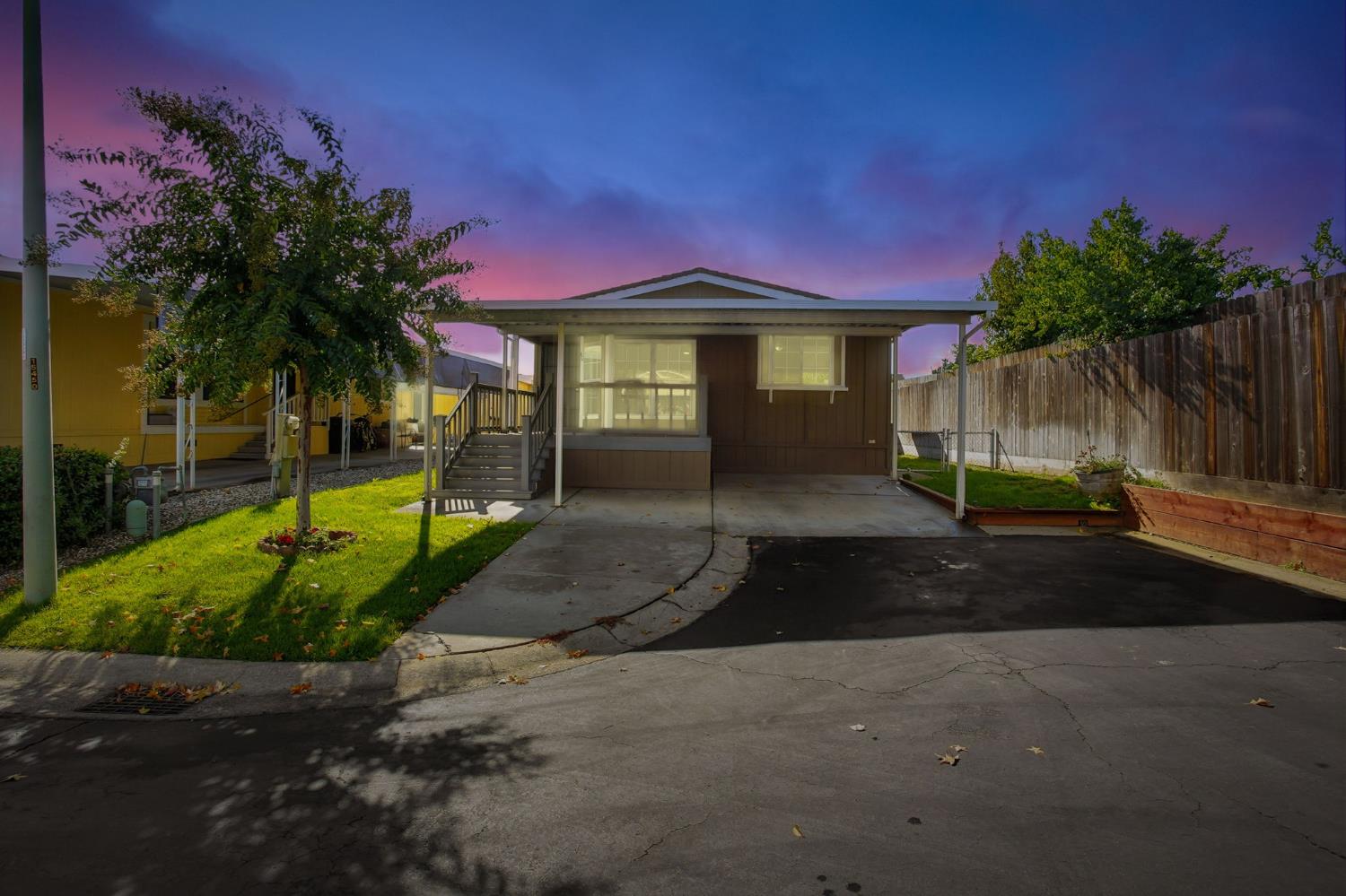 700 2nd Street, Unit 40 Galt, CA 95632 - Photo 35 of 35 a front view of a house with a yard and garage