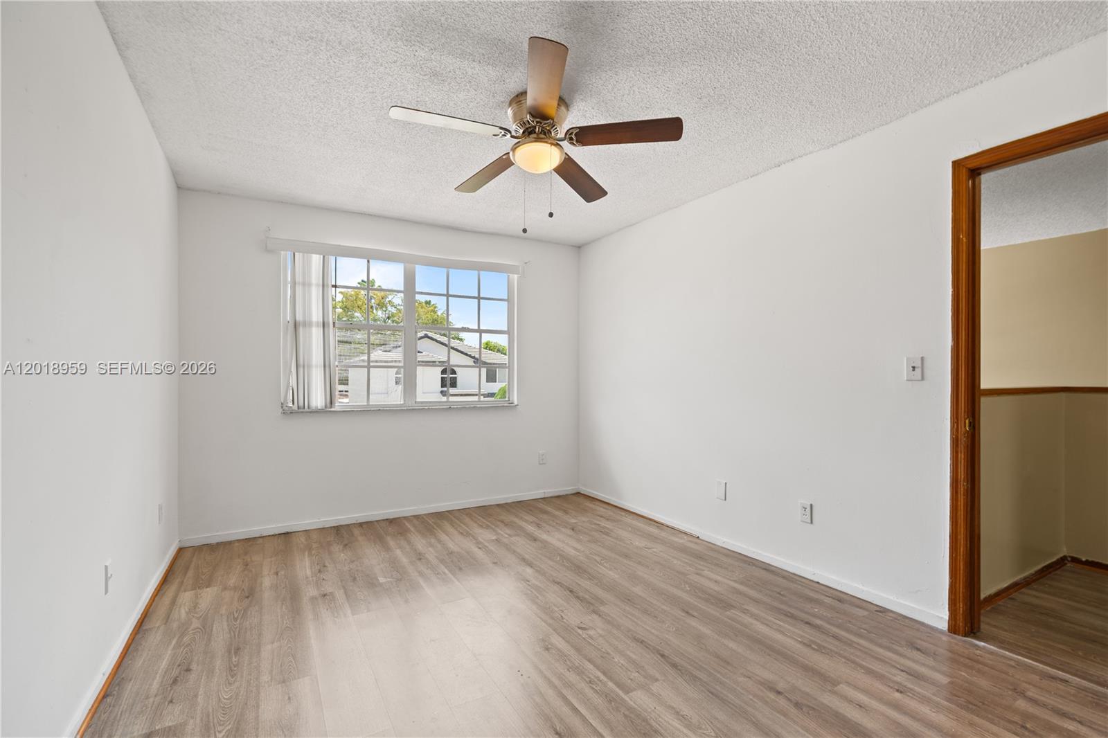 15345 Southwest 63rd Terrace Miami, FL 33193 - Photo 26 of 51 wooden floor in an empty room with a window