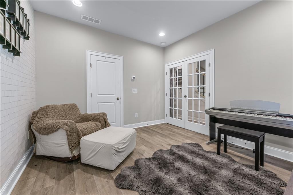3766 Alstead Manor Way Suwanee, GA 30024 - Photo 18 of 41 a bedroom with furniture and a window