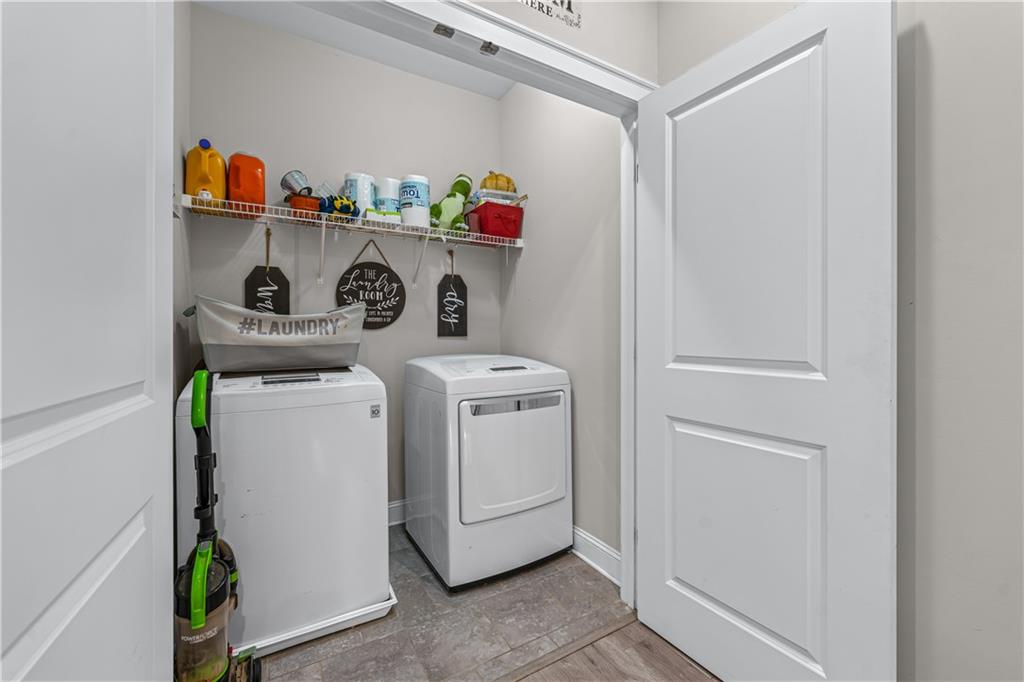 3766 Alstead Manor Way Suwanee, GA 30024 - Photo 21 of 41 a utility room with dryer and washer
