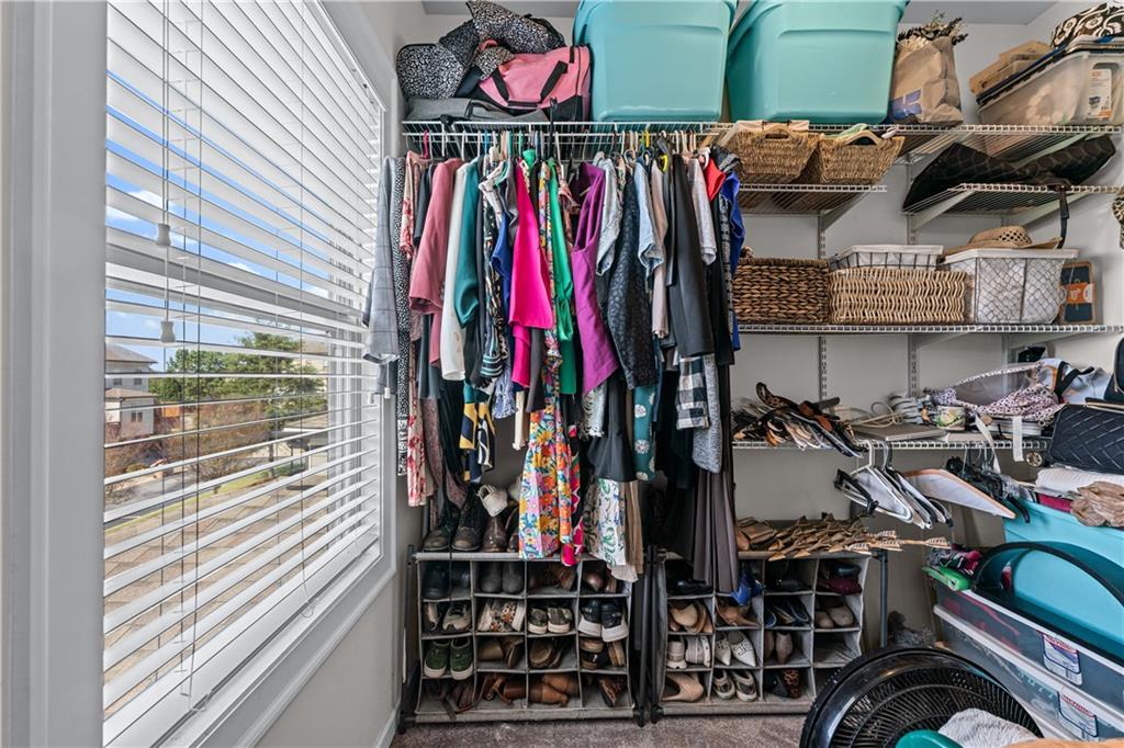 3766 Alstead Manor Way Suwanee, GA 30024 - Photo 29 of 41 a view of walk in closet with clothes