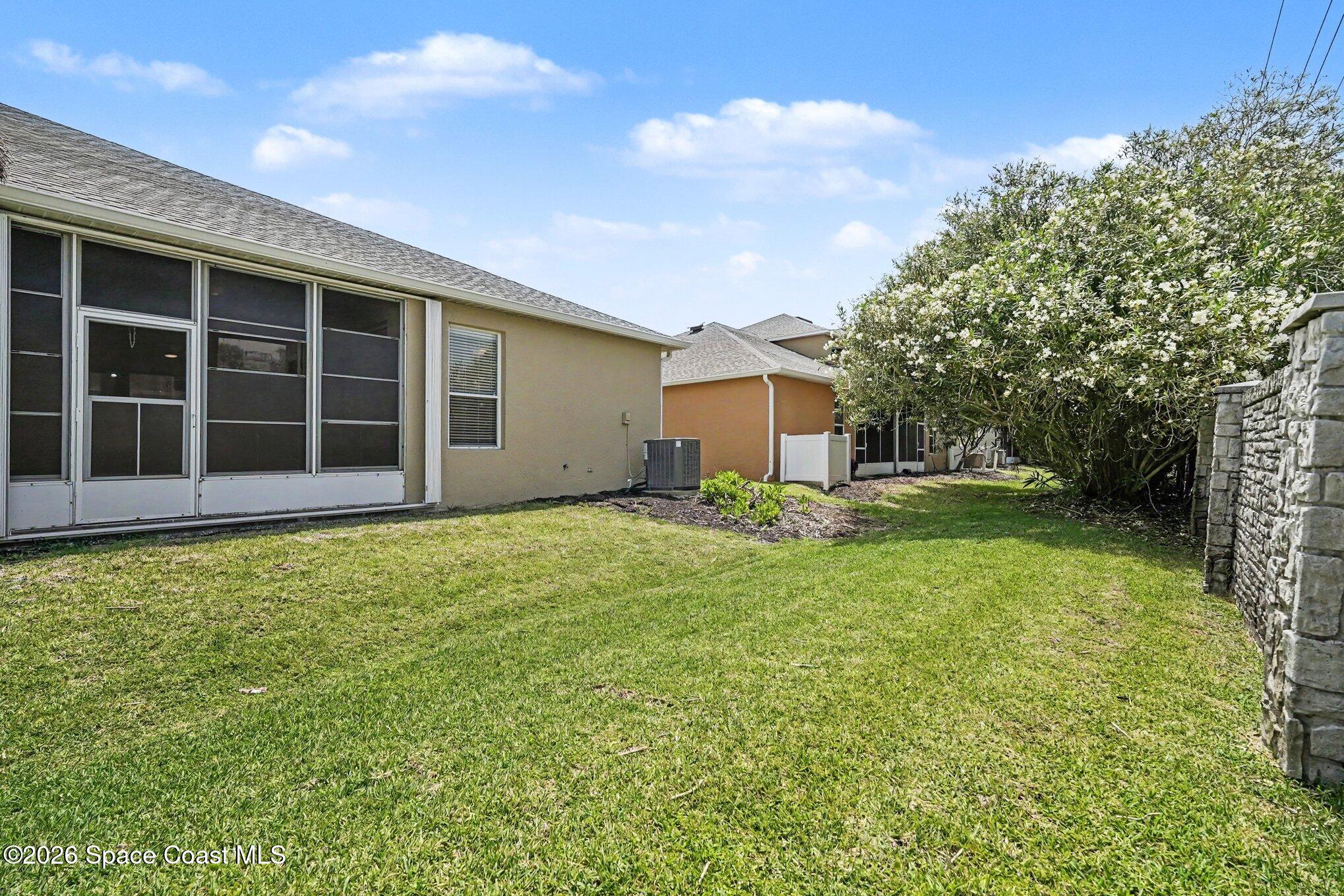 284 Intrepid Way Indialantic, FL 32903 - Photo 6 of 36 a house with garden in front of it