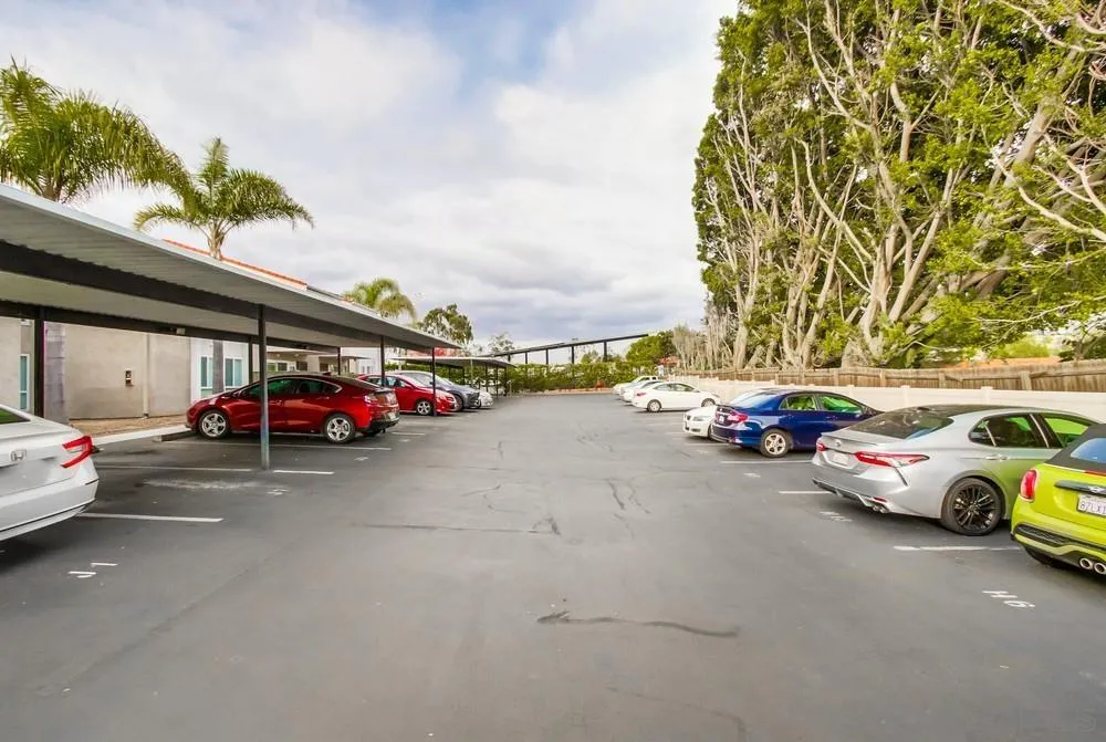 3583 Ruffin Road, Unit 112 San Diego, CA 92123 - Photo 54 of 59 a view of a cars parked in a parking lot