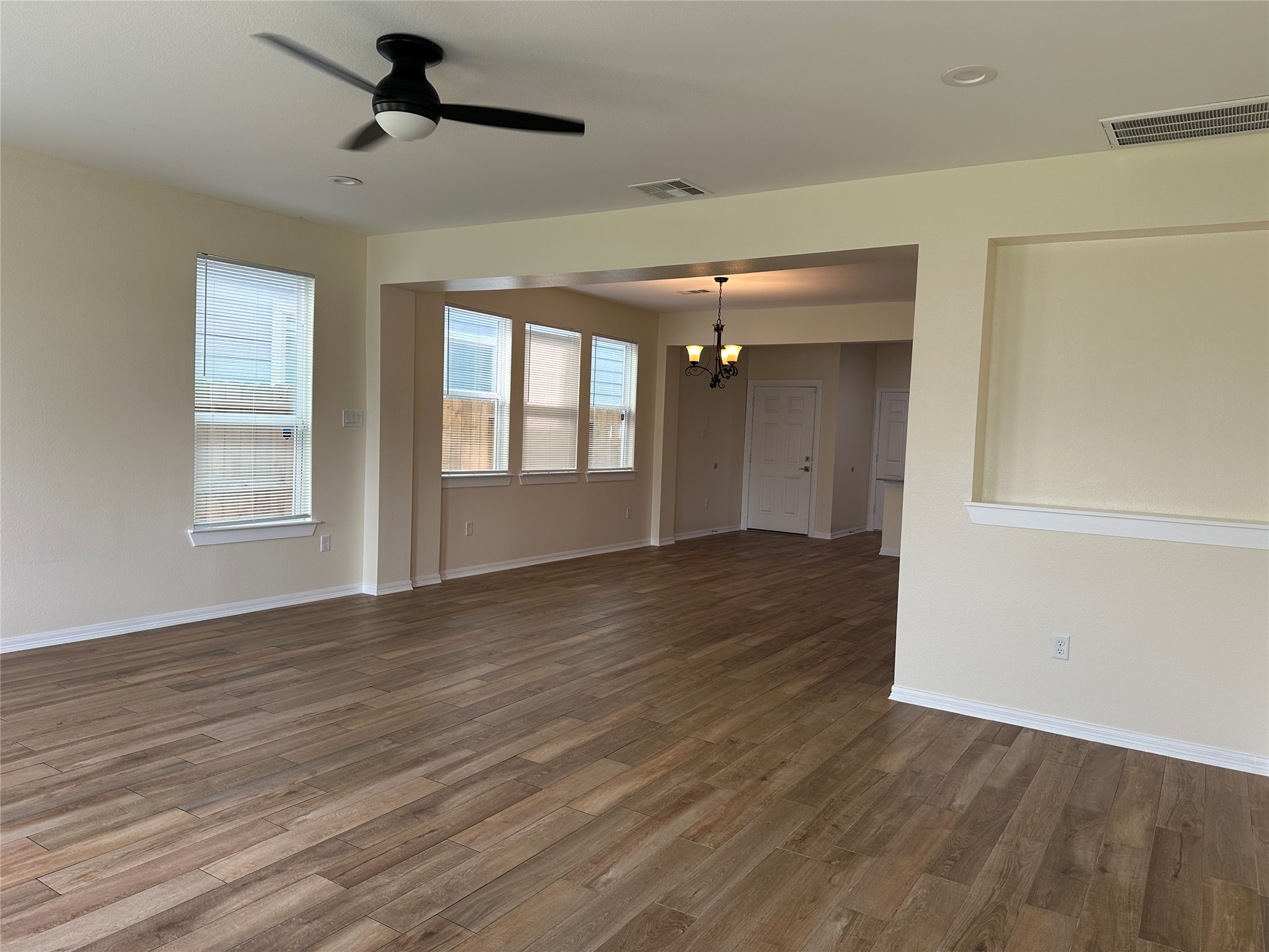2015 Harlem Street Houston, TX 77020 - Photo 7 of 18 a view of empty room with wooden floor and fan