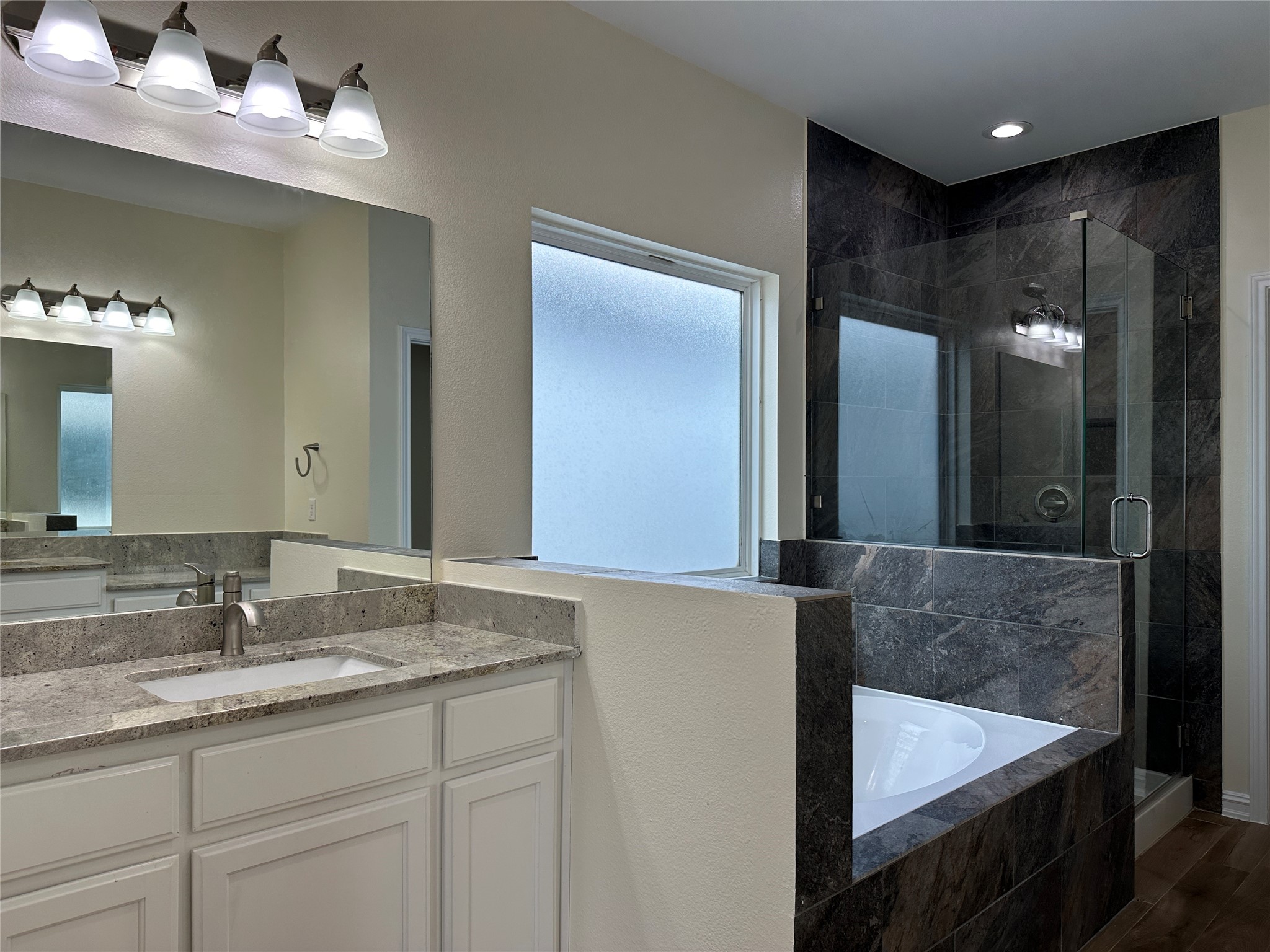 2015 Harlem Street Houston, TX 77020 - Photo 10 of 18 a bathroom with a double vanity sink and a mirror