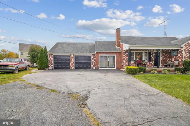 a bedroom with a bed and chair