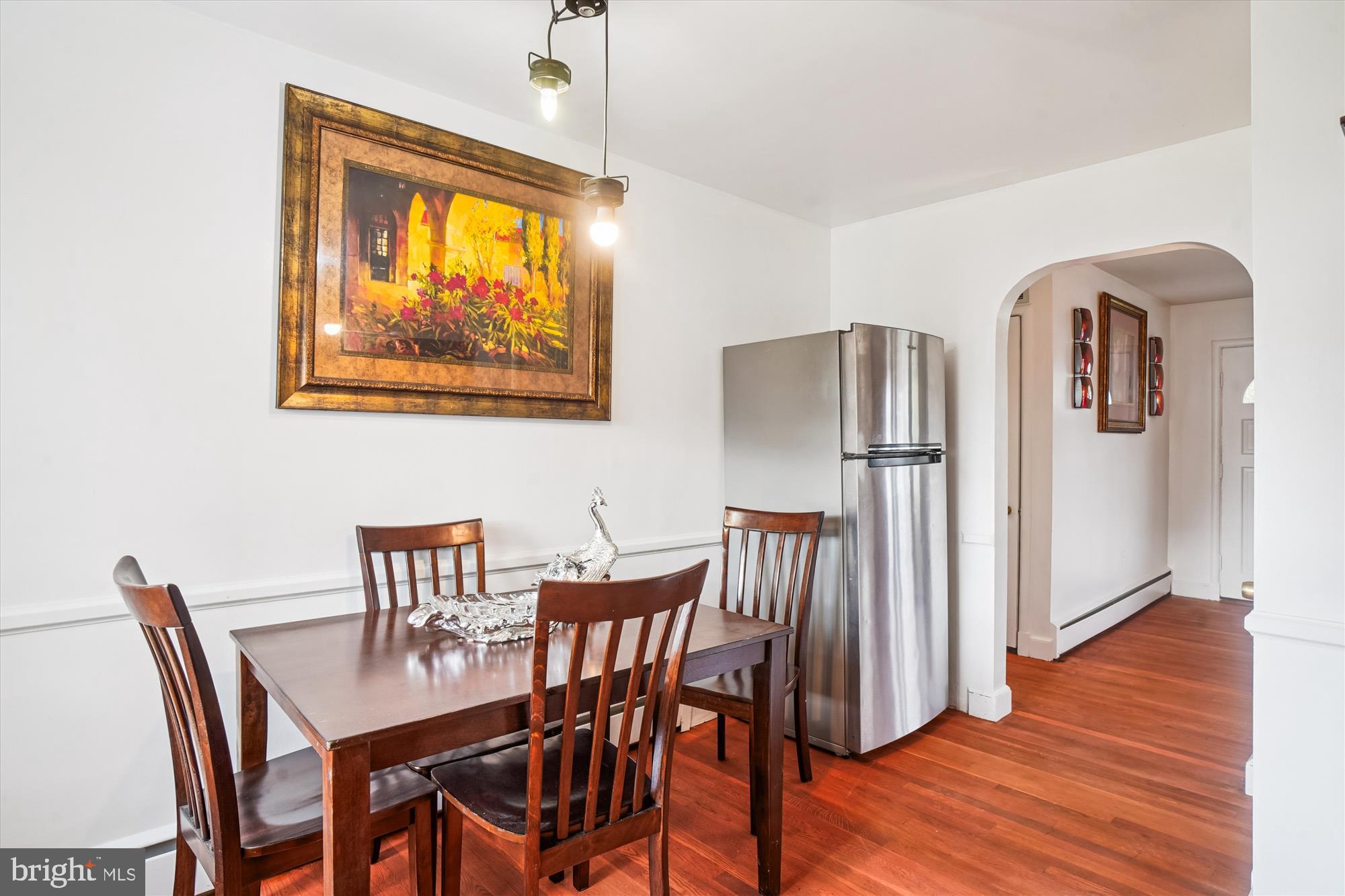 8803 Biggs Ford Road Walkersville, MD 21793 - Photo 26 of 58 a view of a dining room with furniture and wooden floor
