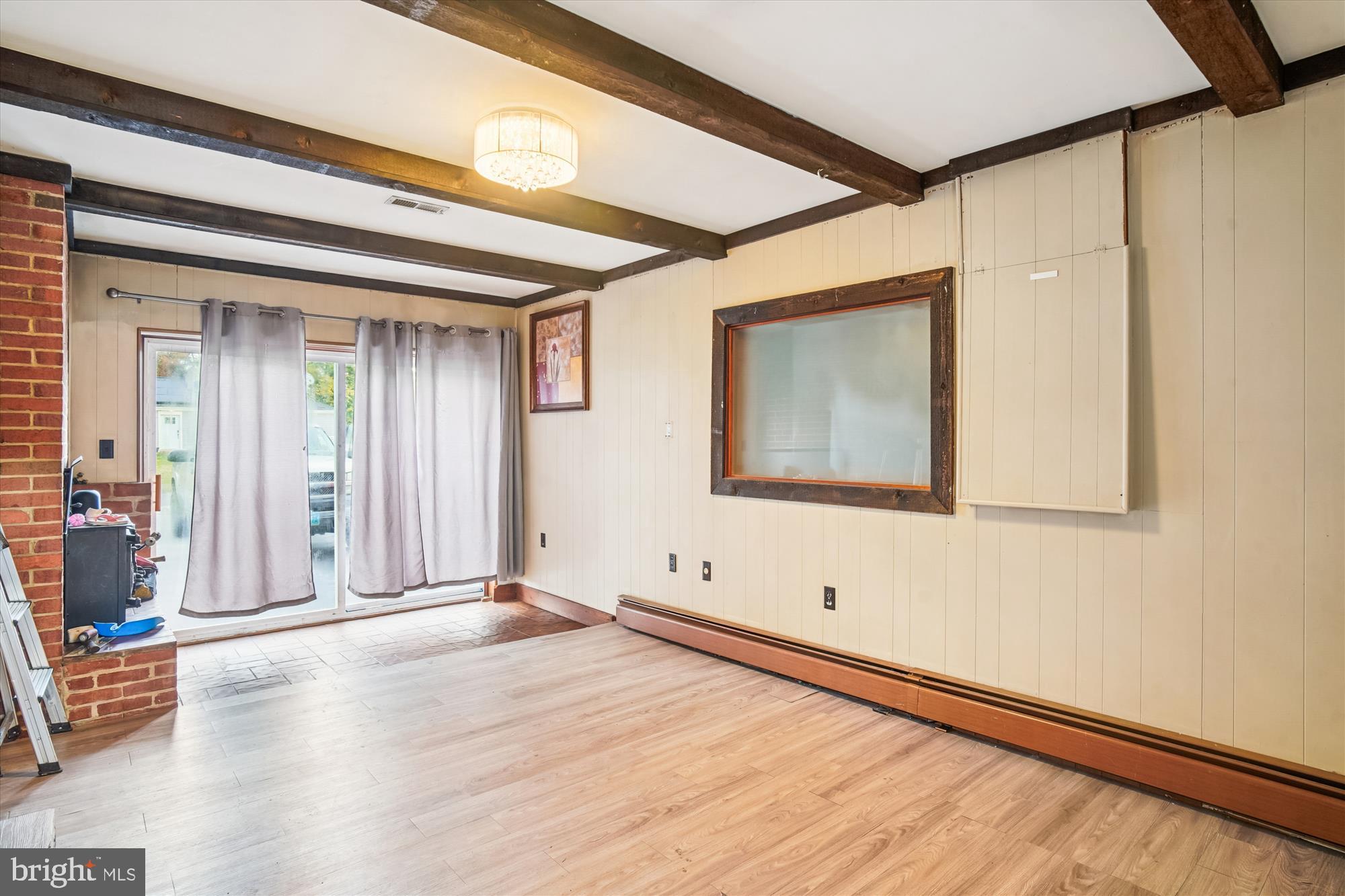 8803 Biggs Ford Road Walkersville, MD 21793 - Photo 28 of 58 a view of an empty room with wooden floor and a window