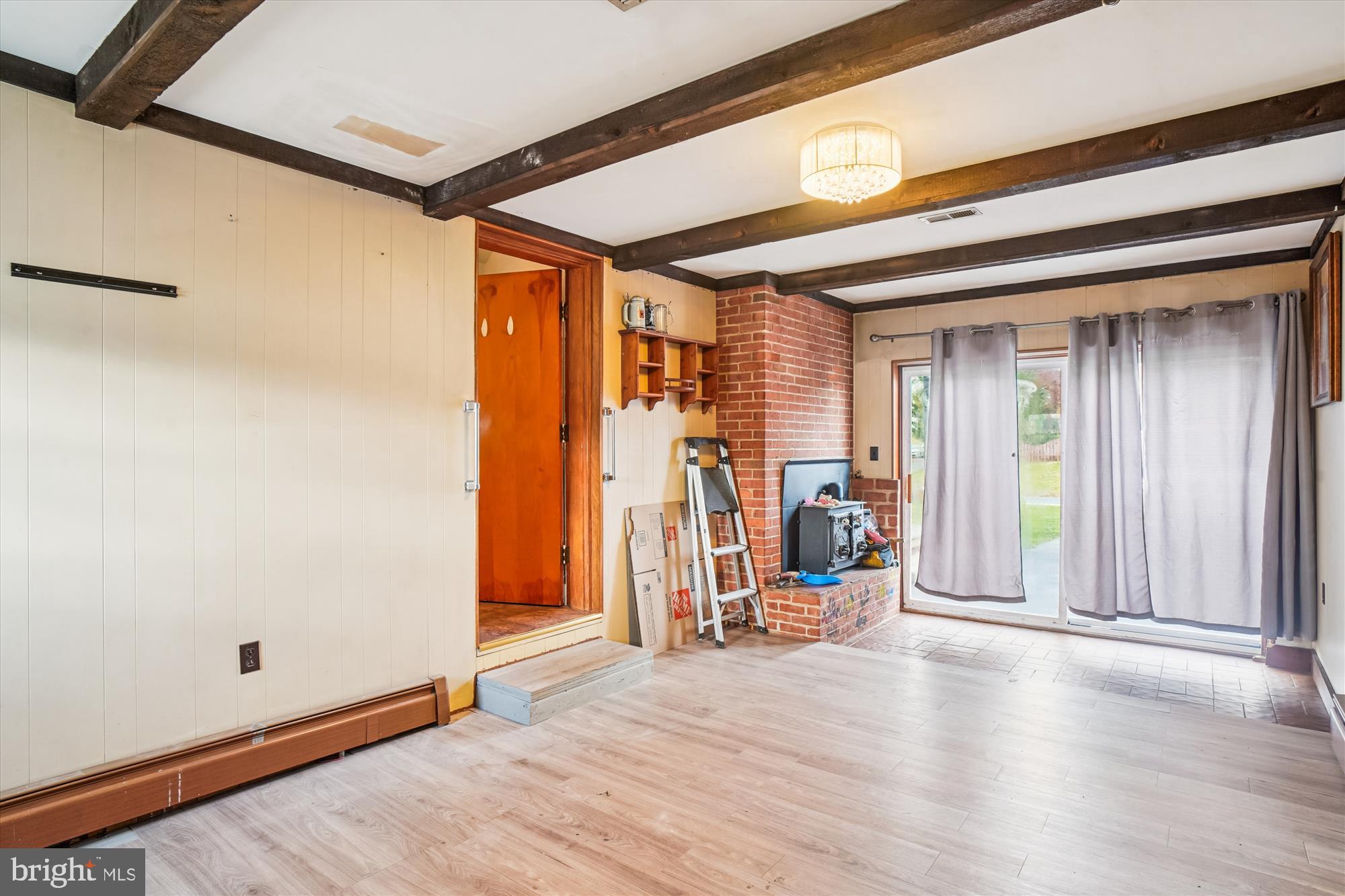 8803 Biggs Ford Road Walkersville, MD 21793 - Photo 30 of 58 a view of a hallway with wooden floor and windows
