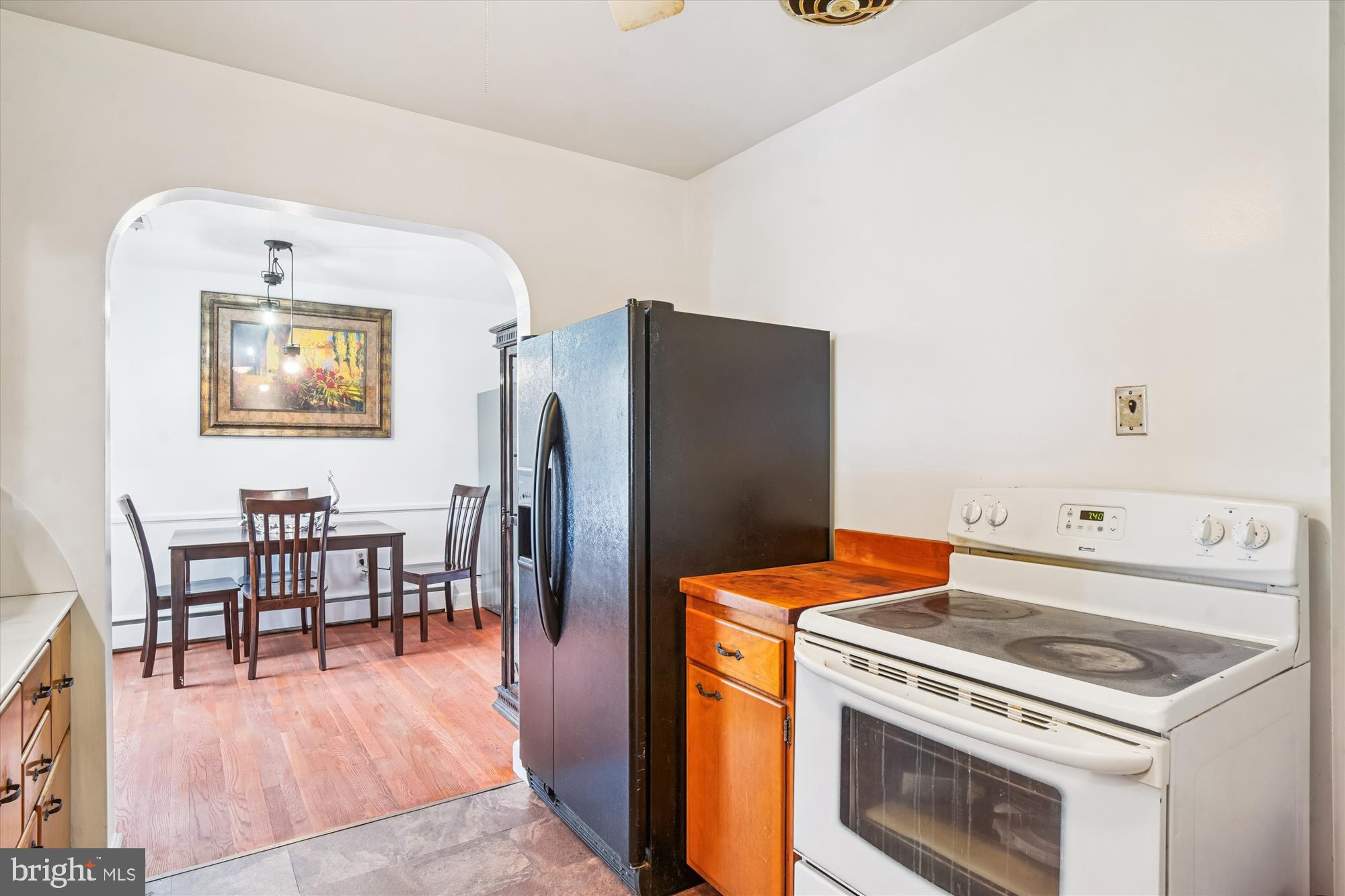 8803 Biggs Ford Road Walkersville, MD 21793 - Photo 34 of 58 a kitchen with a stove and a refrigerator