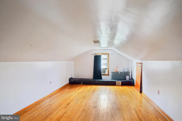 a big room with a table and chairs