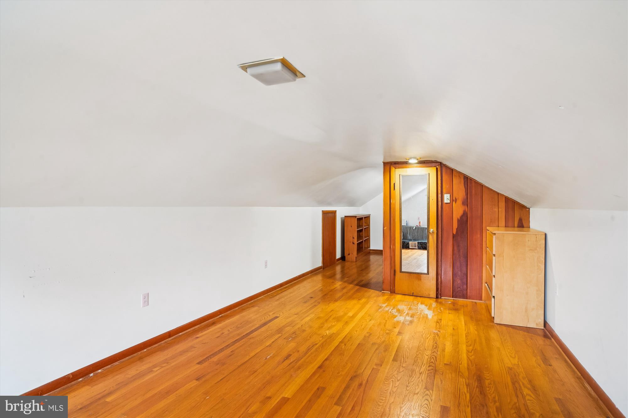 8803 Biggs Ford Road Walkersville, MD 21793 - Photo 42 of 58 a view of an empty room with wooden floor and a window