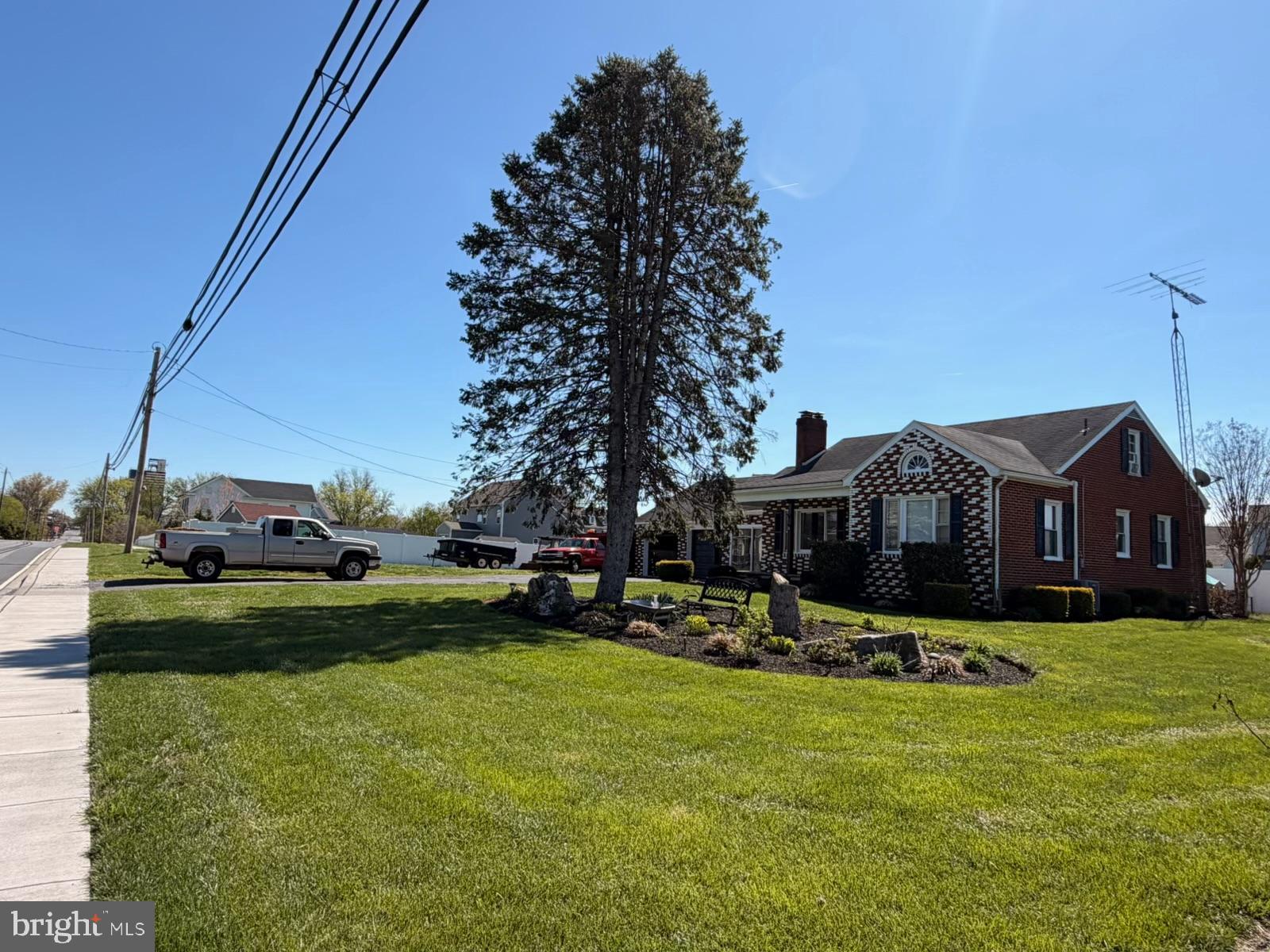 8803 Biggs Ford Road Walkersville, MD 21793 - Photo 60 of 80 a front view of a house with a yard table and chairs