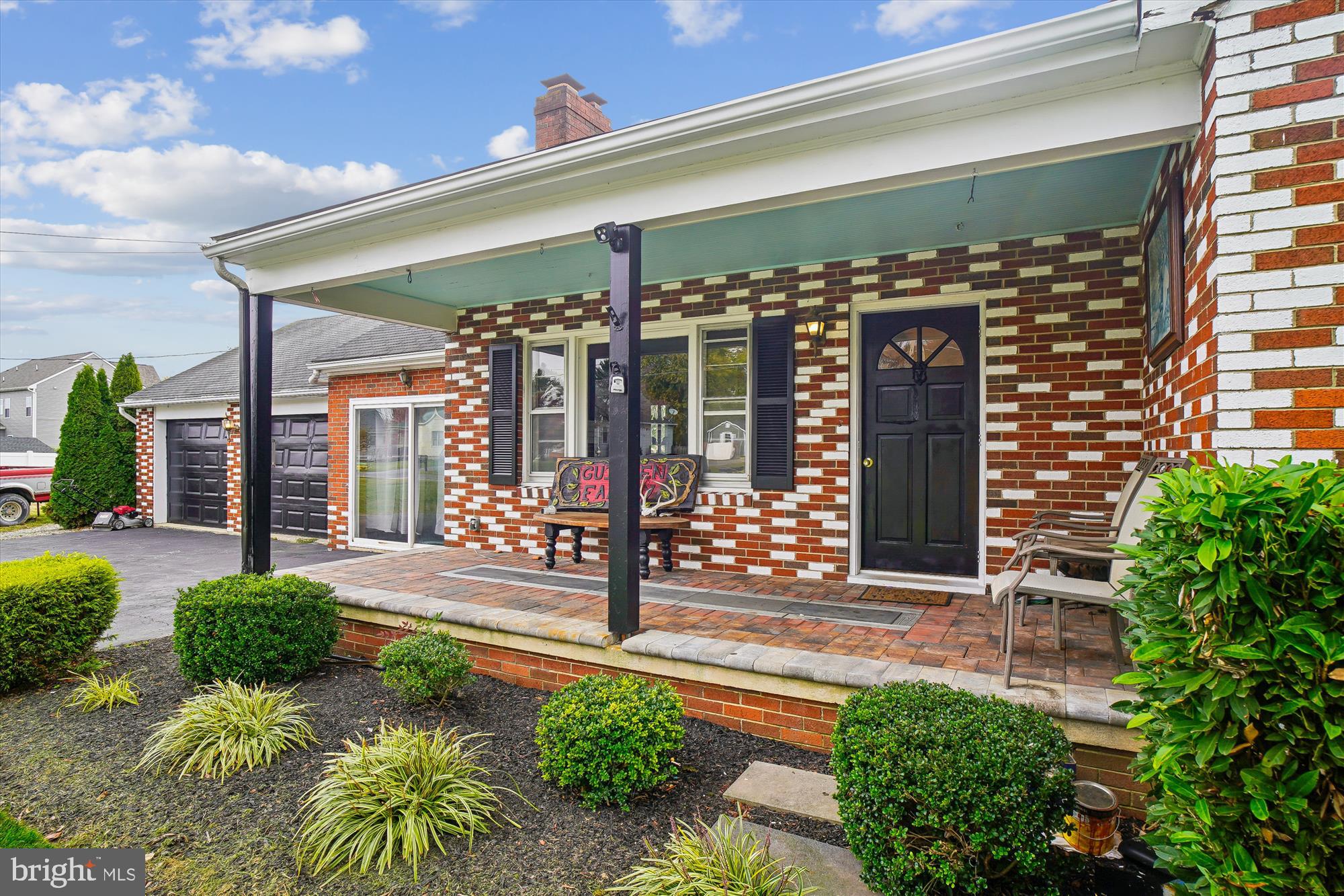 8803 Biggs Ford Road Walkersville, MD 21793 - Photo 6 of 58 a view of a porch with a table and chairs and potted plants