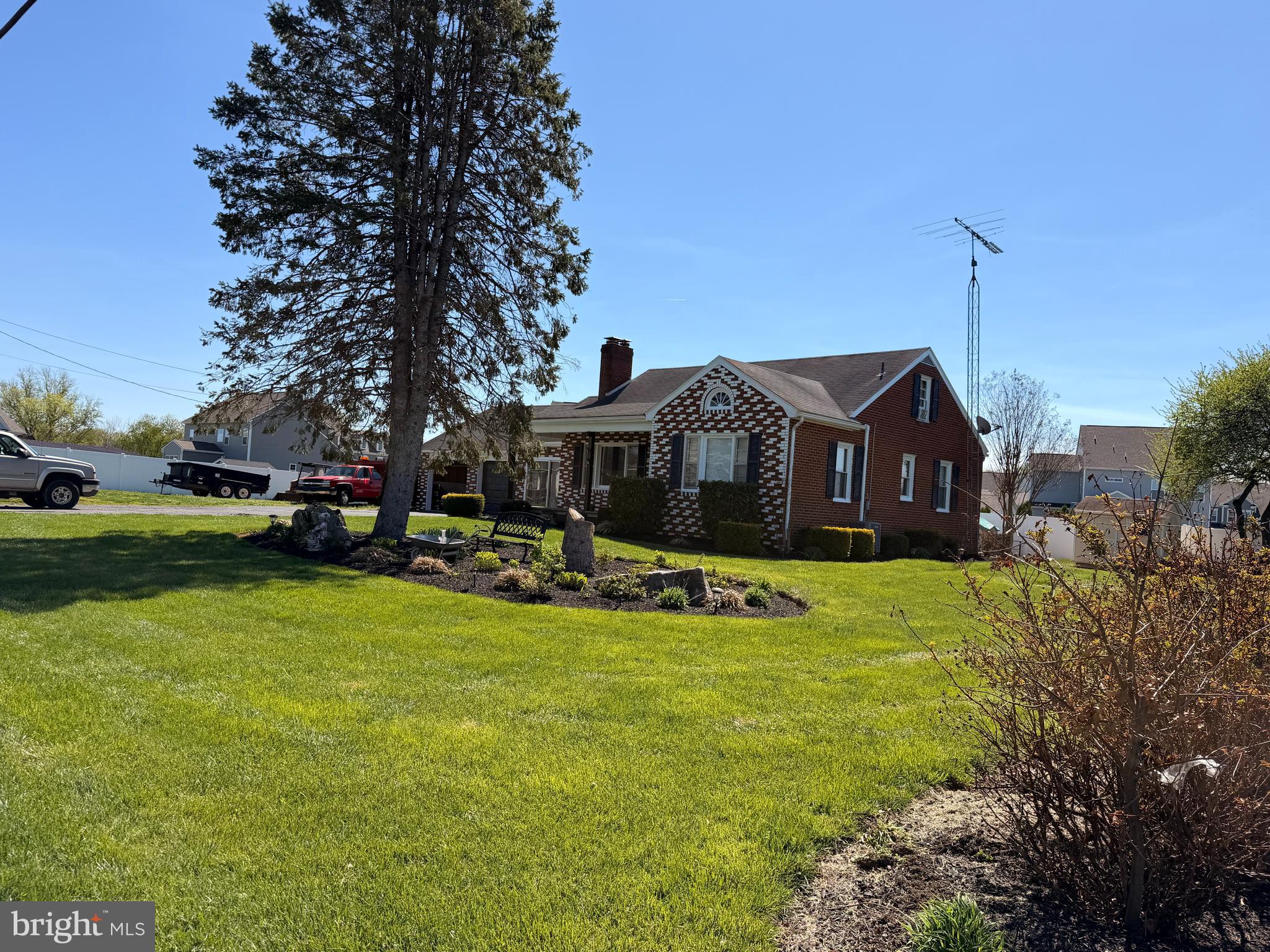 8803 Biggs Ford Road Walkersville, MD 21793 - Photo 66 of 80 a view of a house with a big yard potted plants and a large tree