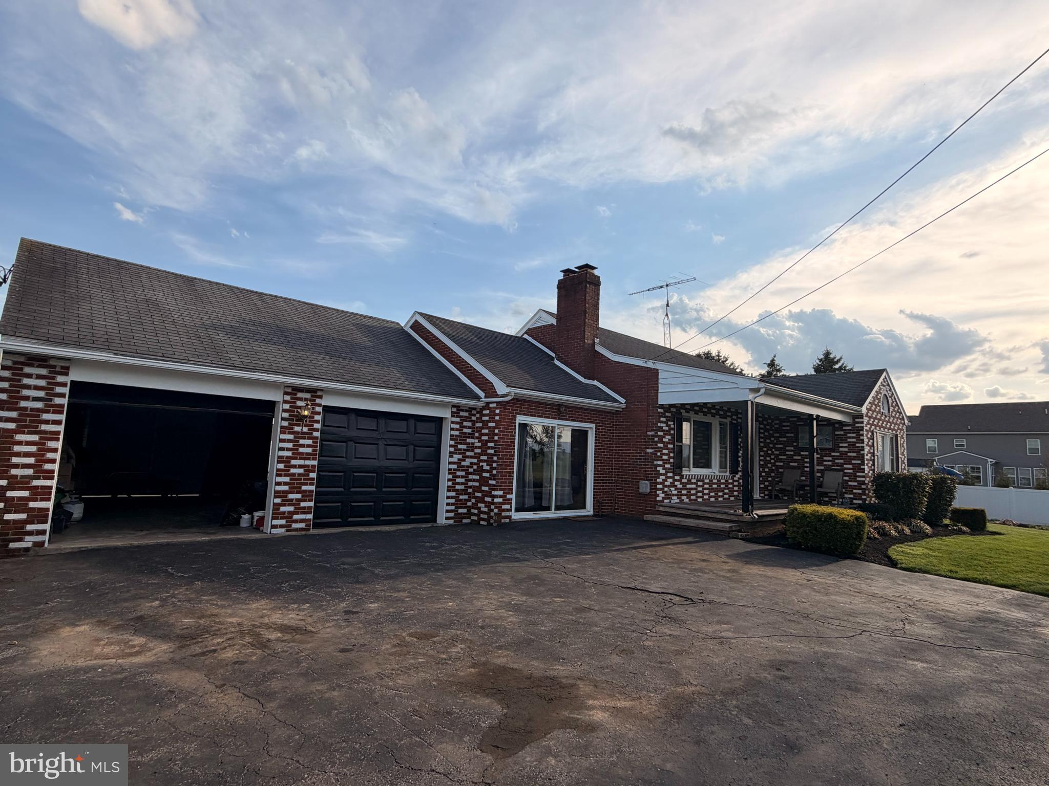 8803 Biggs Ford Road Walkersville, MD 21793 - Photo 72 of 80 a front view of a house with a yard and garage