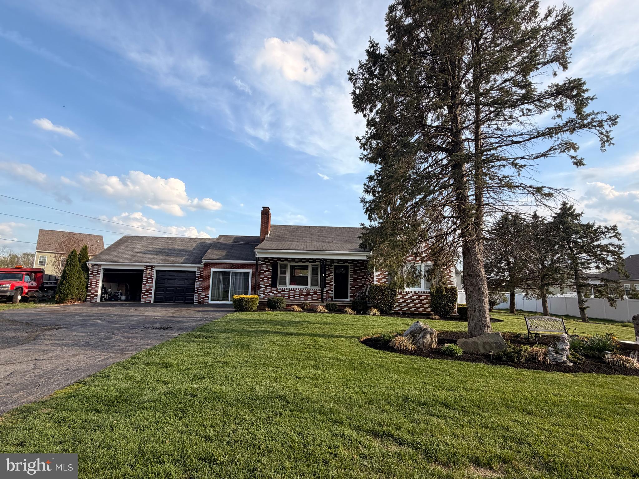 8803 Biggs Ford Road Walkersville, MD 21793 - Photo 75 of 80 a front view of a house with a garden and trees