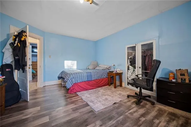 a bedroom with a bed and a desk