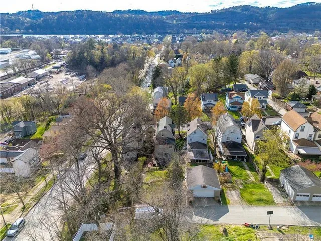 an aerial view of residential house and green space