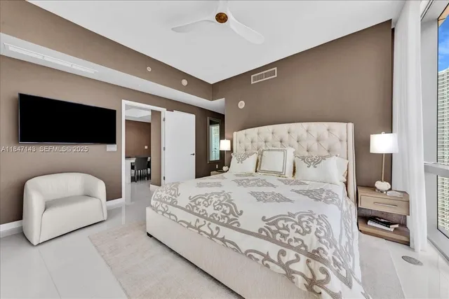 a view of walk in closet and bedroom