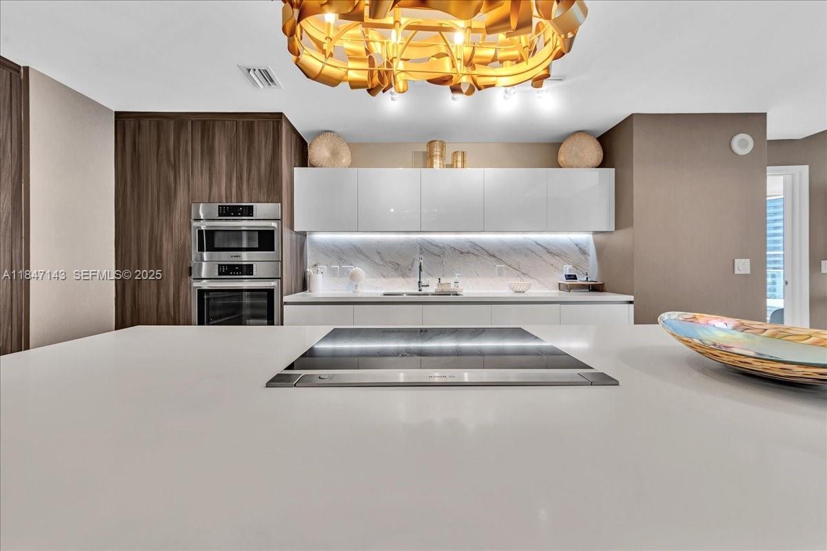 851 Northeast 1st Avenue, Unit 3711 Miami, FL 33132 - Photo 8 of 47 a view of spacious kitchen with a sink