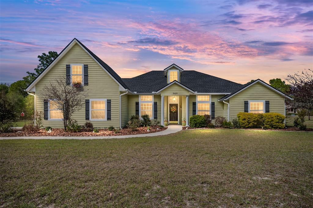 a front view of a house with a yard