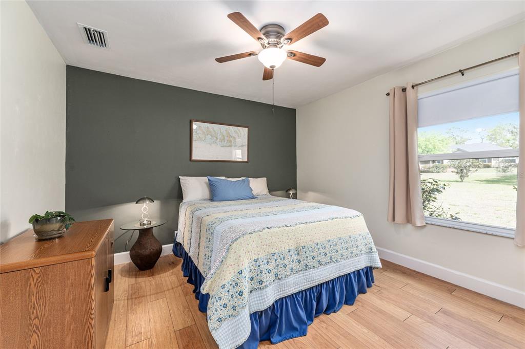 8420 Southwest 92nd Lane Gainesville, FL 32608 - Photo 19 of 46 a bedroom with a bed and a window