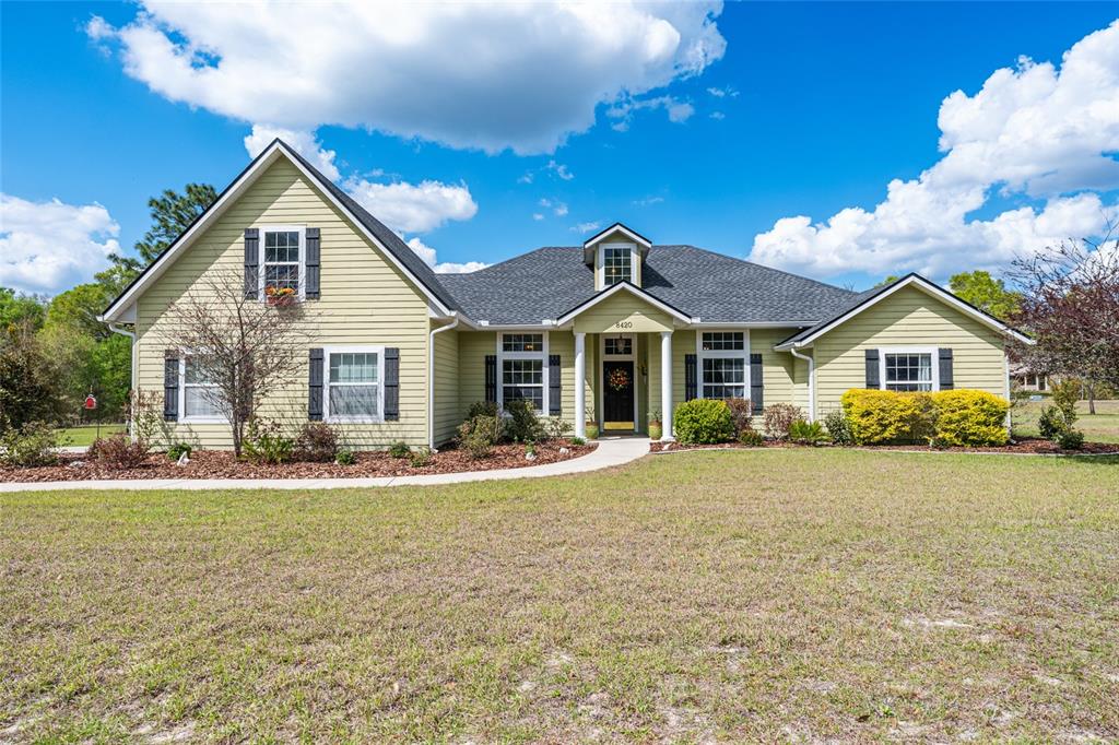 8420 Southwest 92nd Lane Gainesville, FL 32608 - Photo 2 of 46 a front view of a house with a yard