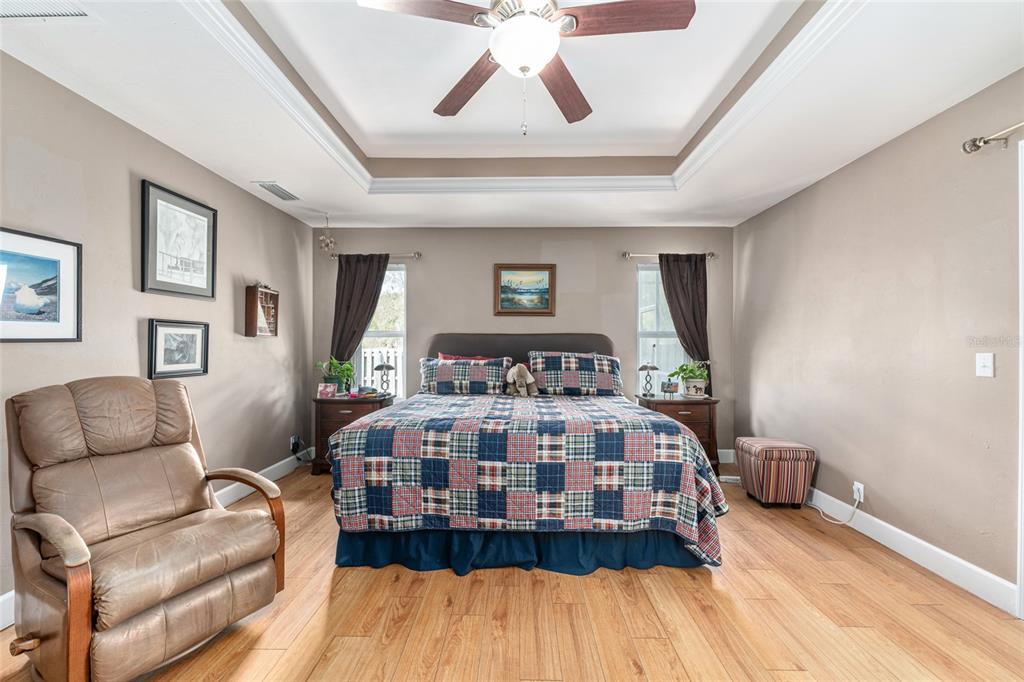 8420 Southwest 92nd Lane Gainesville, FL 32608 - Photo 22 of 46 a bedroom with a bed couch and window