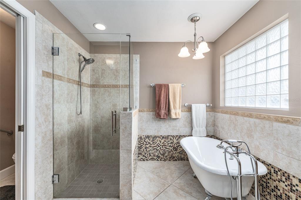 8420 Southwest 92nd Lane Gainesville, FL 32608 - Photo 24 of 46 a bathroom with a bathtub shower and toilet